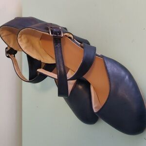 Navy blue heels with criss cross straps.